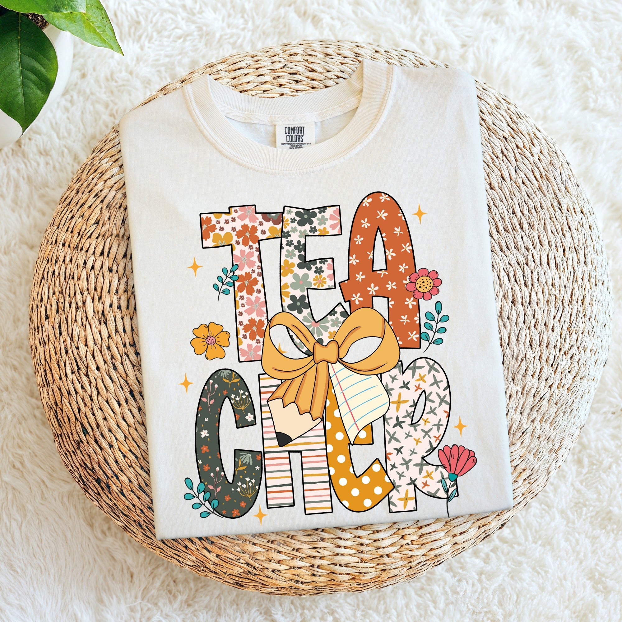 Colorful Teacher stacked with bow