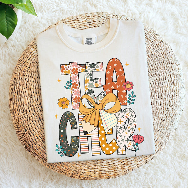 Colorful Teacher stacked with bow